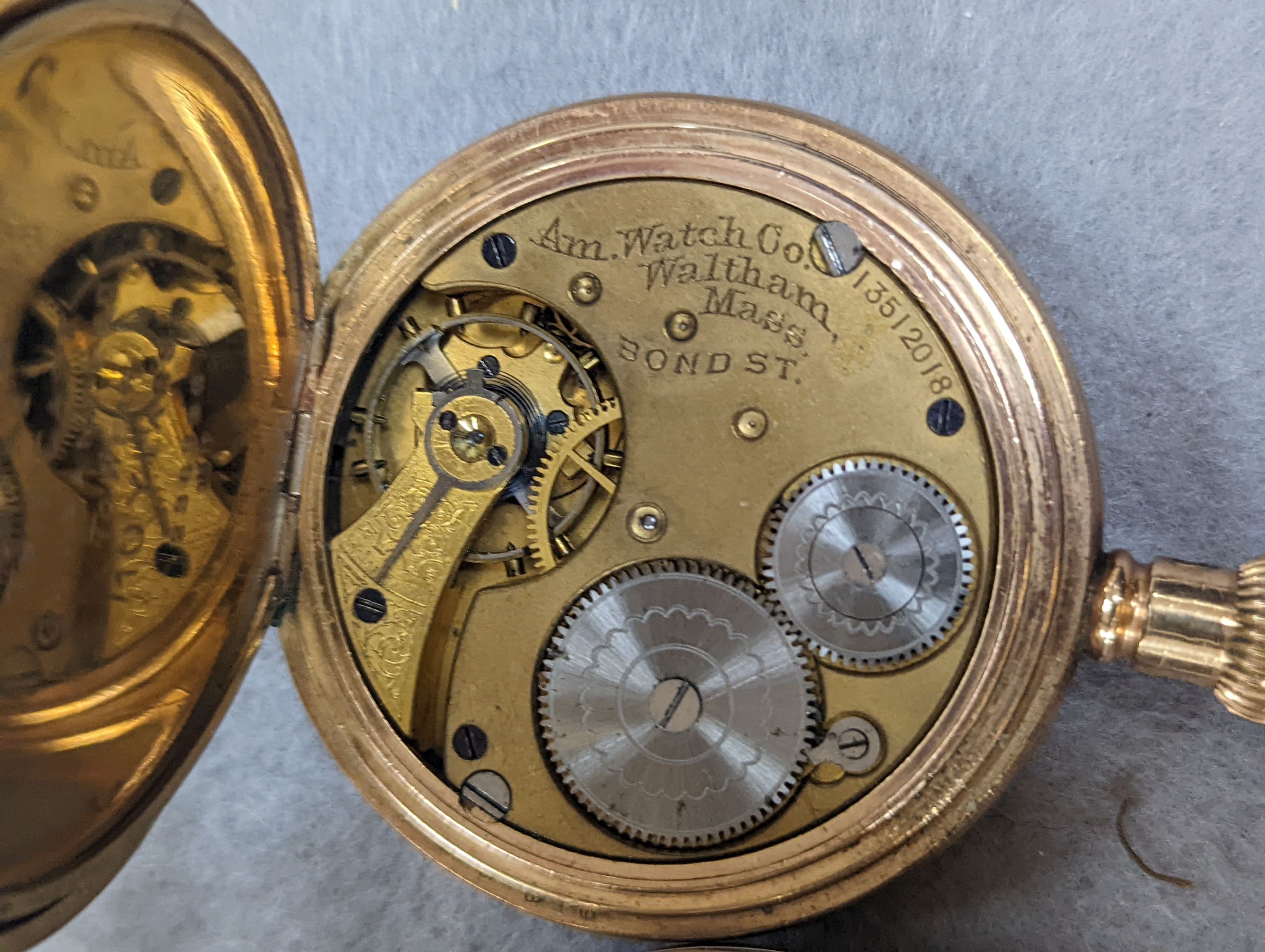 An 18k fob watch(a.f.) gross 20.4 grams, a 9ct wrist watch on a 9ct expanding bracelet, gross 20.7 grams, a gold plated pocket watch, an 800 fob watch and a 19th century silver pair cased verge keywind pocket watch, by J